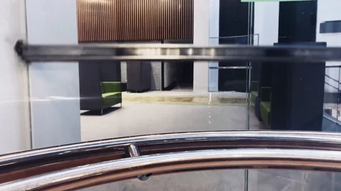 Modern glass elevator inside contemporary corporate office building Stock Footage 224895071