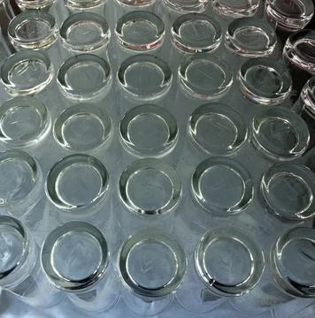 Modern glass empty transparent tableware glasses and plates. Stock Photos