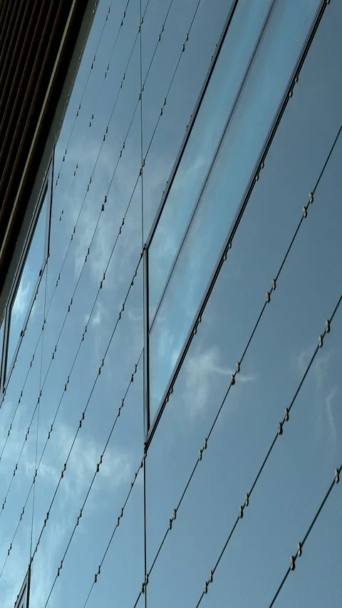 Modern Glass Facade Reflecting Blue Sky Architecture In Stock Footage 331353102