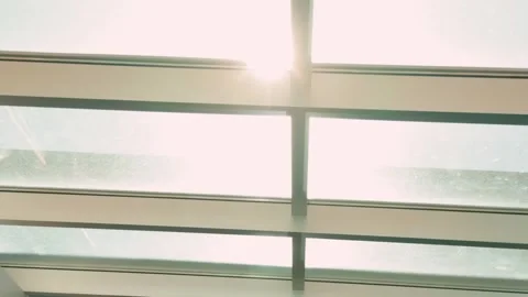 Modern glass skylight ceiling interior in slow forward glide with downward pan Stock Footage 332636359