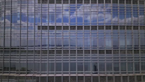 Modern glass skyscraper. camera moves up. Stock Footage 240684646