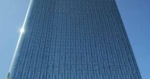 Modern glass structure symbolizes digital future and innovation. Clean grid refl Stock Footage 324620385