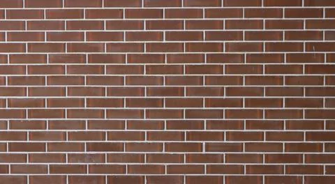 Modern glossy brown brick-effect tile Stock Photos