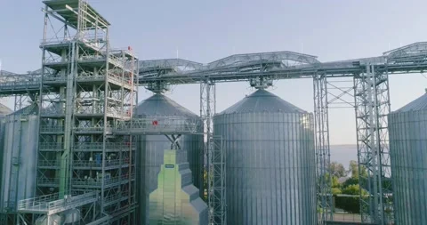 Modern grain silo. Storage of grain in a metal elevator 動画素材 143069554
