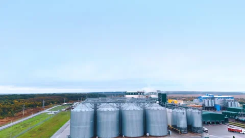 Modern grain silos elevator surrounded by agricultural fields Vídeos de archivo 296645362
