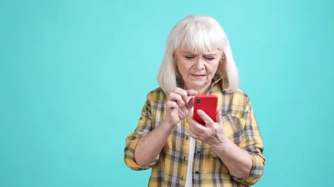 Modern granny use technology surfing connection isolated cyan color background 動画素材 170519267