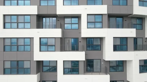 Modern gray building of residential complex close-up, urban geometry. Stock Footage 243548224
