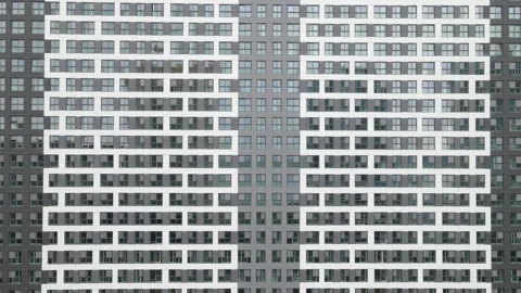 Modern gray building of residential complex, urban geometry. Stock Footage 243696424