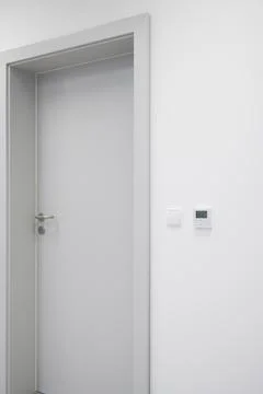 Modern Gray Door with Control Panel and Light Switch Stock Photos