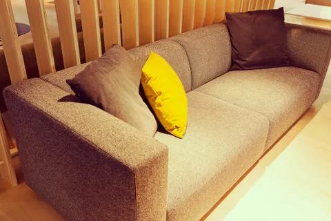 Modern gray sofa Stock Photos