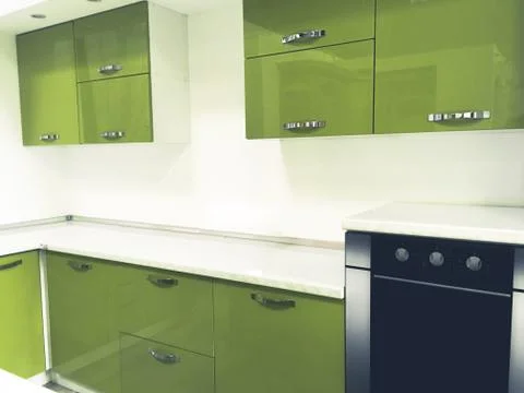Modern green colored kitchen interior Stock Photos