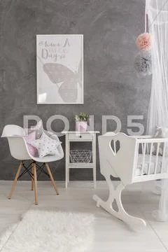 A modern grey baby room with white accessories Stock Photos