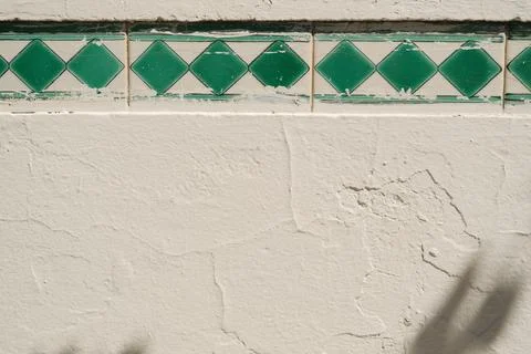 Modern grey limestone texture with green square tiles background Stock Photos