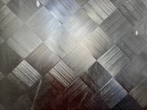 Modern grey metallic square tile background with brushed stainless steel texture Stock Photos
