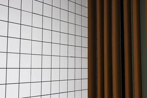 Modern Grid Tiled Wall With Vertical Wooden Slats Stock Photos