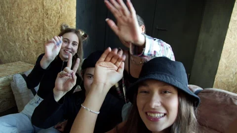 Modern group of school kids sends greetings to everyone who watches the online Stock Footage 160368443