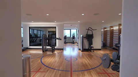 The modern gym interior features elliptical machines and offers a stunning city 库存影片 295072169
