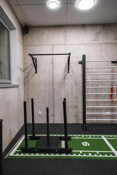 Modern gym room with sled, pull up bar, and turf lane in Dolomites Stock Photos