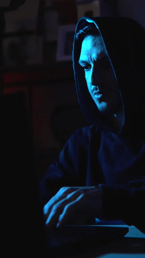 Modern hacker typing on laptop representing cyberattack, identity theft and Stock Footage 310357400
