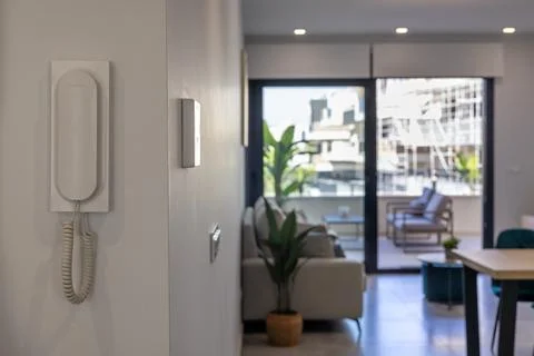 Modern hallway with intercom and open view to balcony seating Stock Photos