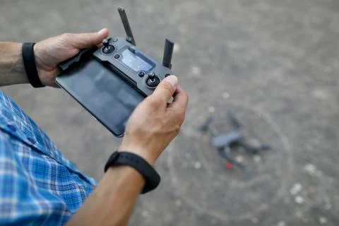 Modern with hand remote copter on gray Stock Photos
