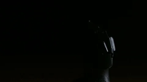 Modern Handgun in low light key Stock-Footage 80660483