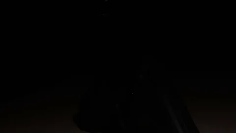 Modern Handgun in low light key Stock-Footage 80660577