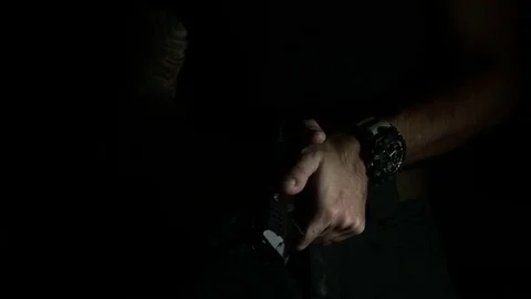 Modern Handgun in low light key Stock-Footage 80660630