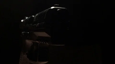 Modern Handgun in low light key Stock Footage