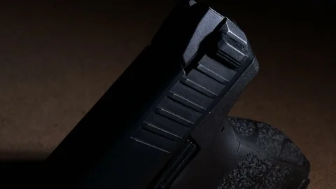 Modern Handgun in low light key Stock-Footage 80660778
