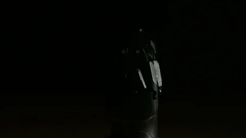 Modern Handgun in low light key Stock-Footage 80660799