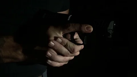 Modern Handgun in low light key Stock-Footage 80660849