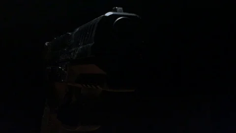 Modern Handgun in low light key Stock-Footage 80660938