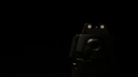 Modern Handgun in low light key Stock Footage