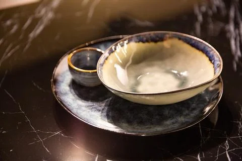 Modern handmade tableware, on a marble table Stock Photos