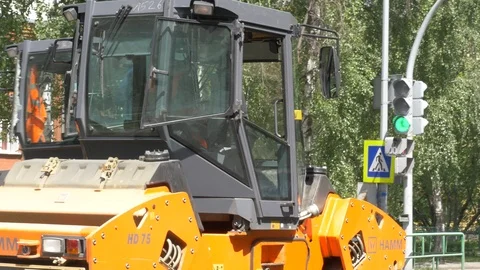 Modern heavy asphalt roller that stack and press hot asphalt. Stock Footage 111142043