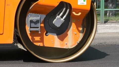 Modern heavy asphalt roller that stack and press hot asphalt. Stock Footage 111142064