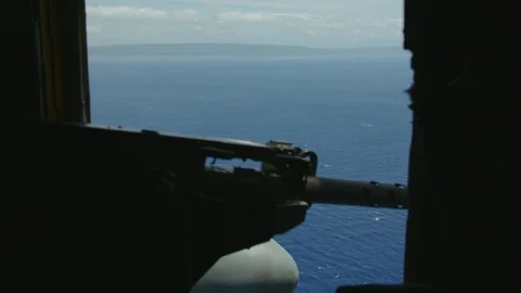 Modern heavy machine gun inside an airborne military helicopter Stock Footage 117731393