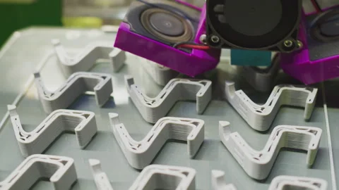 Modern hi tech production. Printer prints complex parts from special plastic Stock Footage 256976029