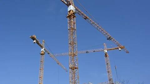 Modern High-Rise Construction Site with Multiple Tower Cranes Stock Footage 331583362