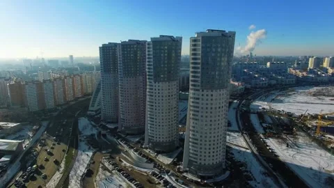 Modern high-rise residential complex under winter aerial drone footage Vídeo Stock 345375444