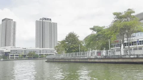 Modern high-rises stand beside calm waters Stock Footage 340034320