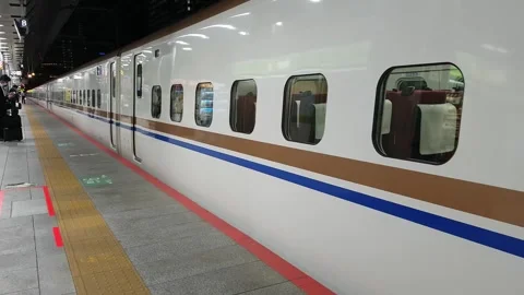 Modern High Speed Bullet train Departing Tokyo station Japan 4K Stock Footage 272232059