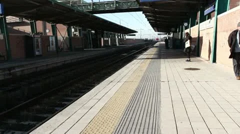 Modern high speed train at the railway station Stock Footage