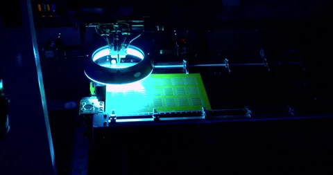 A modern high-tech automated machine assembling an electronic Stock Footage 332996094
