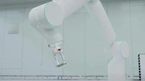 A modern high-tech brandless robotic arm manipulator arm, holds a processor. Video stock 259145731