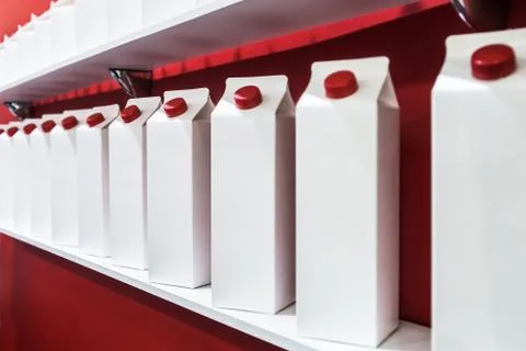 Modern high-tech cardboard packaging for milk, juice and other beverages Foto stock