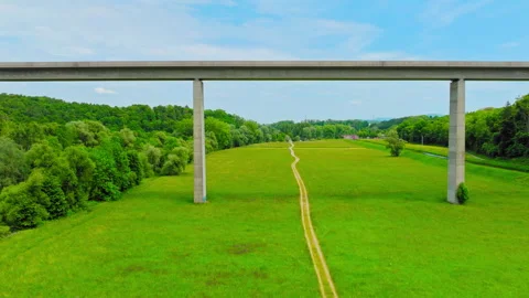 Modern Highway Bridge Cutting Through Green Countryside Stock Footage 315499285
