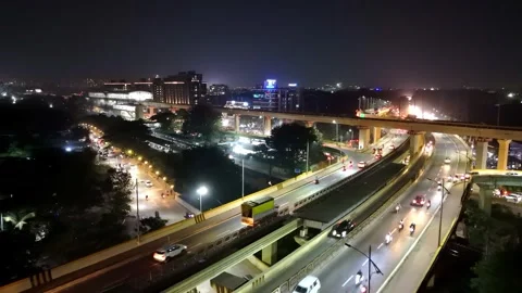 Modern Highway Interchange with City Lights at Night Stock Footage 333261985