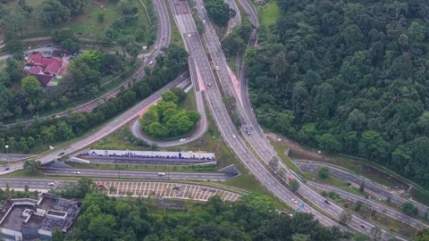 Modern highway interchange surrounded by lush tropical forest. Stock Footage 341414264